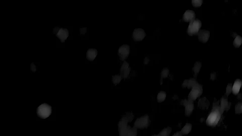 Falling snow at night on black background. Close-up Видео 118975243
