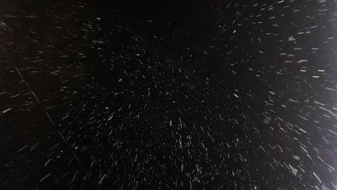 Falling snow at night. Snowflakes falling from the sky during snowstorm Stock Footage 302921873