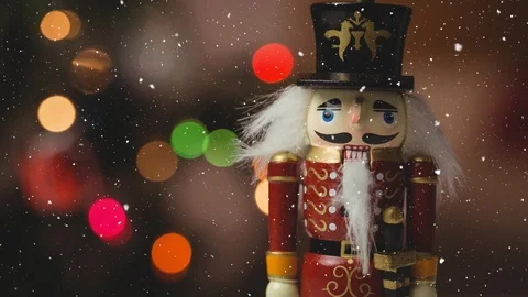 Falling snow with nutcracker Christmas decoration Видео 98011419