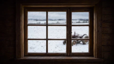 Falling snow outside a cabin window Stock Footage 345430923