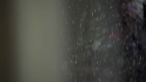Falling snow outside the window at night Stock Footage