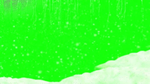 Falling snow particles with a snowdrift base isolated on a green screen Stock Footage 345634874