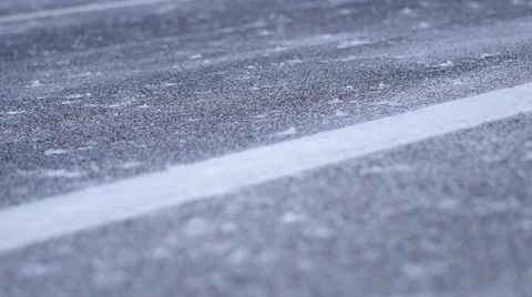 Falling snow on roadway Stock Footage 45544529
