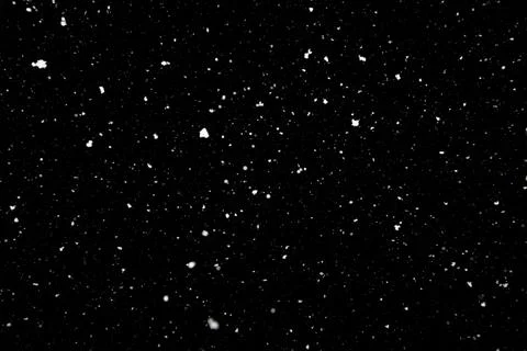 Falling snow texture isolated on black background Stock Photos