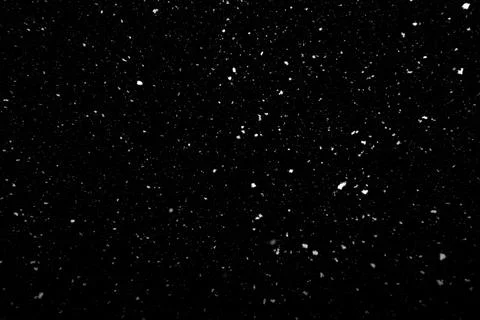 Falling snow texture isolated on black background Stock Photos