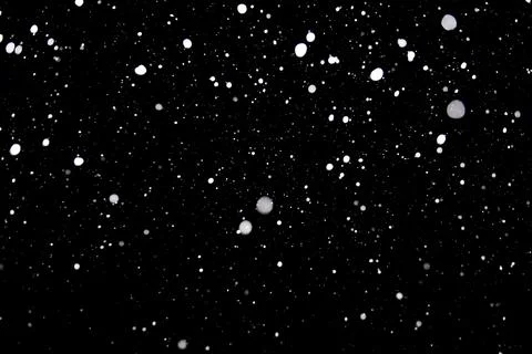 Falling snow texture isolated on black background Stock Photos