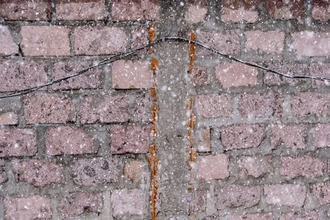 Falling snow texture over weathered stone wall. Stock-Fotos