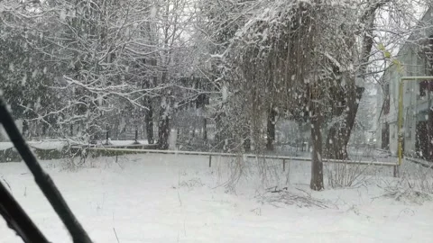 Falling Snow Through The Car Window Stock Footage 154900343