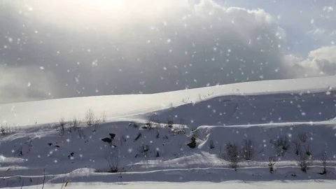 Falling snow in a winter landscape background - looping snow Stock Footage 69157121