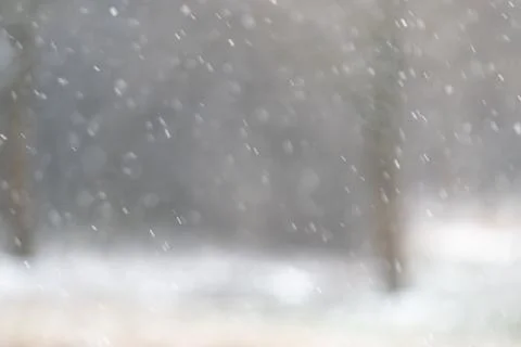 Falling snow, wintertime bokeh Stock Photos