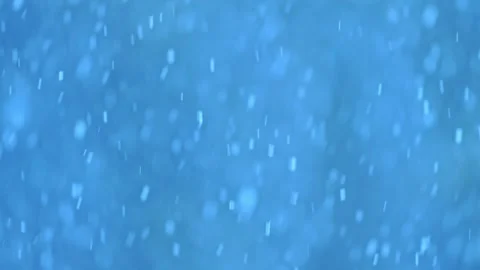Falling snowflakes in 4K slow motion, perfect for winter and holiday-themed Stock Footage 295950977