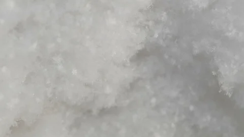 Falling snowflakes close up. Isolated snowflakes falling against a black Stock-Footage 119032406