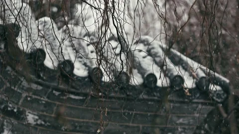 Falling snowflakes on the cornices of ancient Chinese buildings - the first Stock Footage 233578962