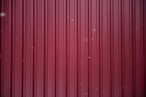Falling snowflakes on a red background Stock Photos