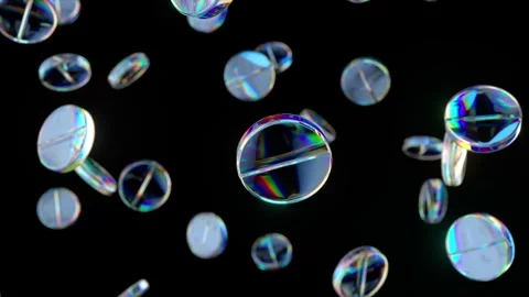 Falling specular pills in slow motion on black isolate background. 3d animation Stock Footage 268438770