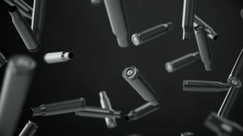 Falling spent cartridges from automatic weapons on a dark background. Stock Footage 297071102
