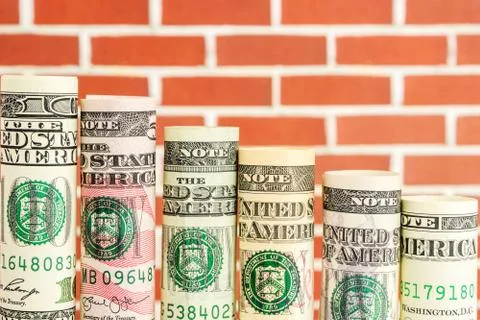 Falling steps made of rolls of all american dollar banknotes Stock Photos