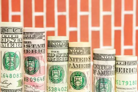 Falling steps made of rolls of all american dollar banknotes Stock Photos