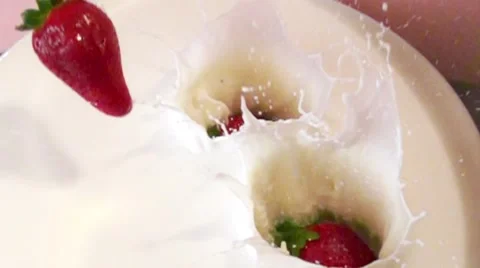 Falling Strawberries in milk in slow motion Stock Footage 54656121