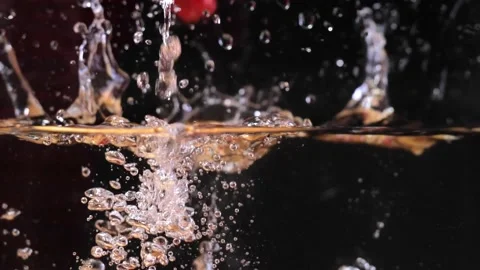 Falling strawberries into the water slow mo Stock Footage 201886412