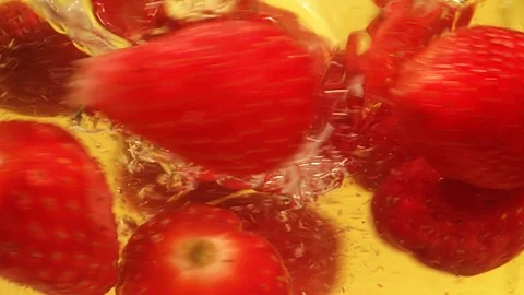 Falling Strawberries into water Slow Motion Macro Video stock 126772058