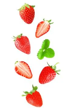 Falling strawberry isolated on white Foto stock