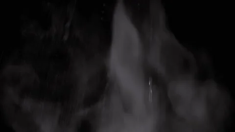 Falling Stream of Splashes on a Rising Cloud of Water Vapor on Black Background Video stock 236191681