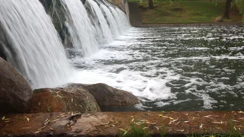 Falling streams of water and flying splashes from a waterfall Stock Footage 156694165