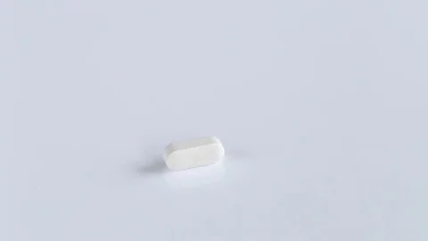 Falling tablet  on white background Stock Footage 70730370