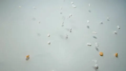 Falling tablets on a white base. Slow motion Vídeo Stock 168253861