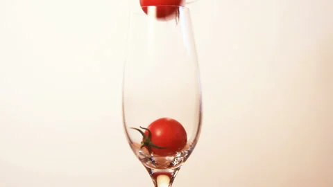 Falling Tomato in a Glass Video stock 327443896