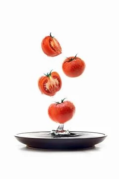 Falling tomato halves cross section 스톡 사진