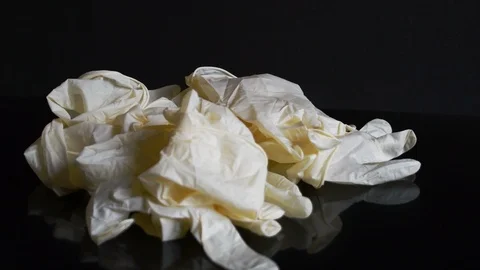 Falling used latex gloves Stock Footage 127513361