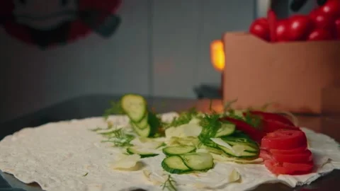 Falling vegetables on shawarma in slow motion. Video stock 137896164