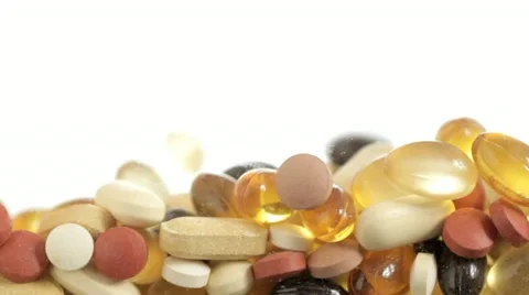 Falling Vitamin Pills Stock Footage