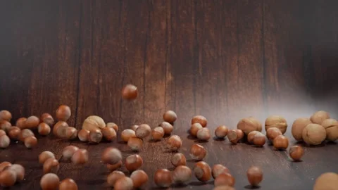 Falling walnuts and hazelnuts in slow motion, studio recording, Genthin, Saxony Stock Footage 334012009
