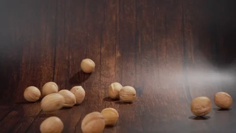 Falling walnuts in slow motion, studio shot, Genthin, Saxony-Anhalt, Germany Stock Footage 334012018