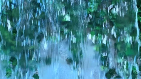 Falling water on the background of a stone wall in a water park Stock Footage 211318846