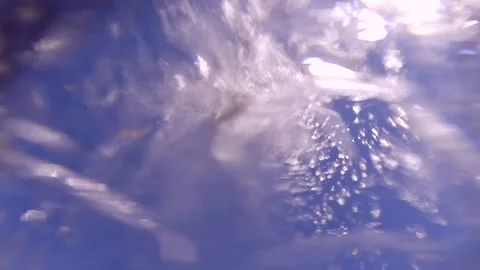Falling water drops on blue sky background, Bottom view Stock Footage 255112388