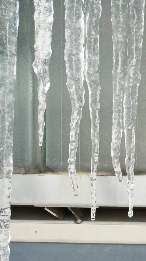 Falling water drops from icicles at springtime, vertical Stock Footage 238089608