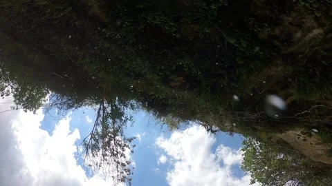 Falling water drops from the rocks on the camera Stock Footage 145871576