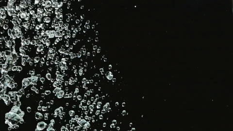 Falling water drops in slow motion on black background. Falling shower droplets Stock-Footage 121701895