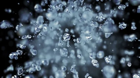 Falling water drops in super slow motion in 4K Stock Footage