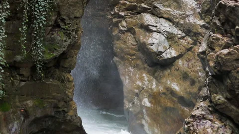 Falling water hitting water surface, some huge rocks seeable in front of frame. Stock Footage 145240144