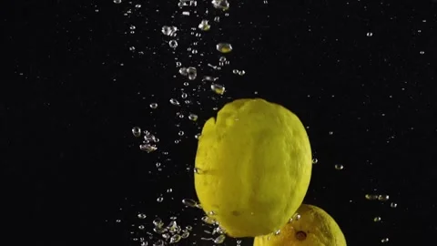 Falling water nutrition. Lemon splash bubble. Fresh citrus floating in water Stock Footage 293086054