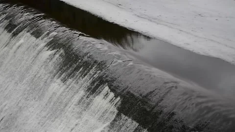 Falling water on a river covered melting ice Stock Footage 149891652