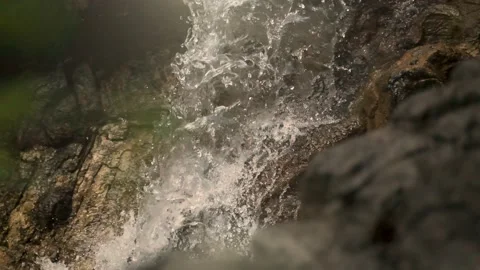 Falling Water in Slow Motion with a cool sun flare Stock Footage 132427858