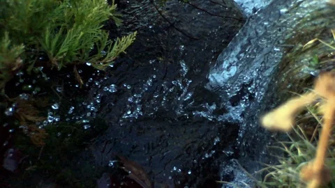 Falling water splashing on rocks Stock Footage 100607352