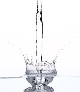 Falling water on white Stock Photos