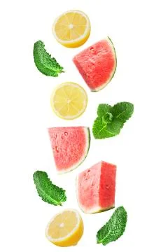 Falling watermelon with lemon and mint isolated on white Stock Photos